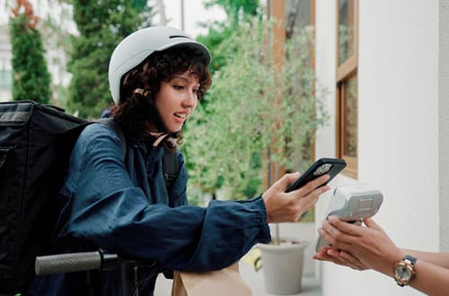 A young gig worker scanning a QR code
